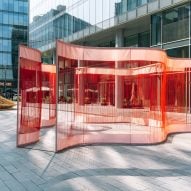 Areen unravels silk fabric for Flowing Threads installation at Dubai Design Week