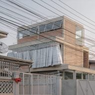 Bangkok Tokyo Architecture creates concrete house with giant silver curtain