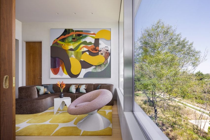 Colourful furniture and large glass windows