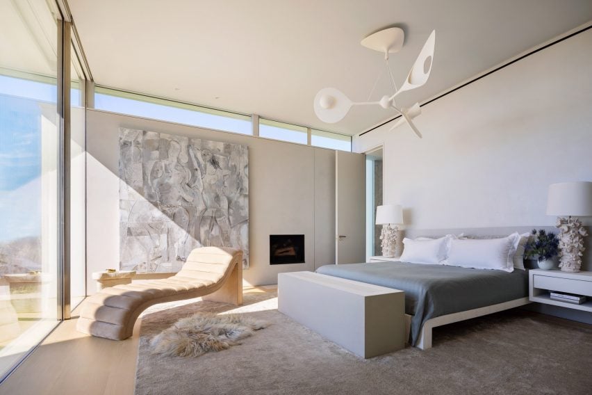 Primary bedroom with sculptural furniture