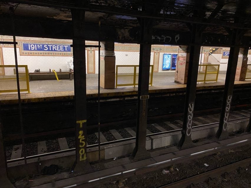 Yellow barriers lining a New York subway station