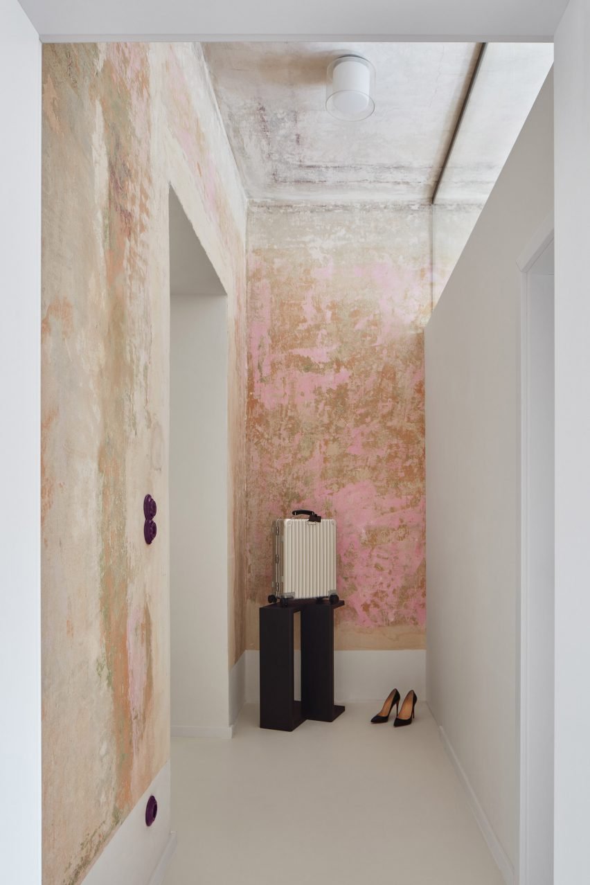 Corridor with flaky pink paintwork