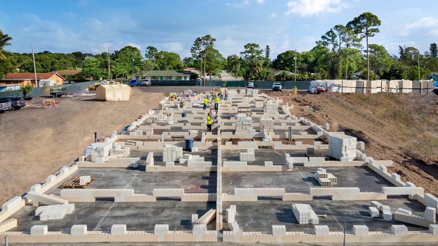 Construction workers laying out building foundation