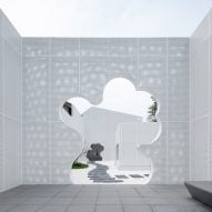 Wutopia Lab and Office ZHU wrap bookstore in perforated facade to mimic clouds
